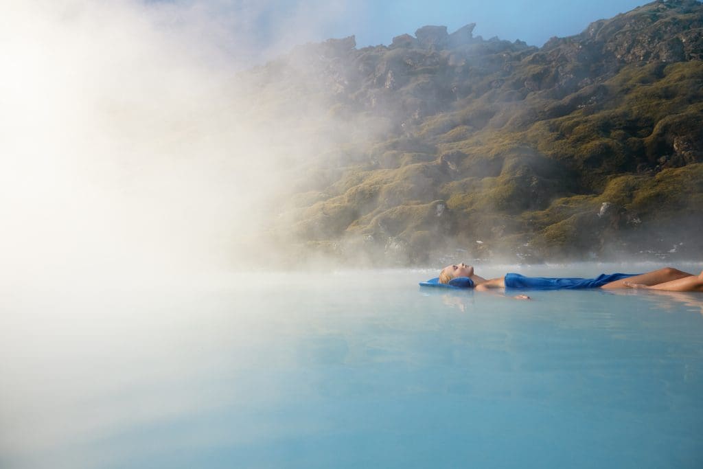 woman_floating_in_blue_water