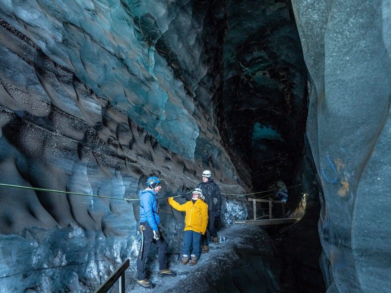people_exploring_katla_ice_cave_iceland